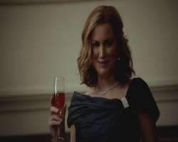 Alice Evans consuming alcohol